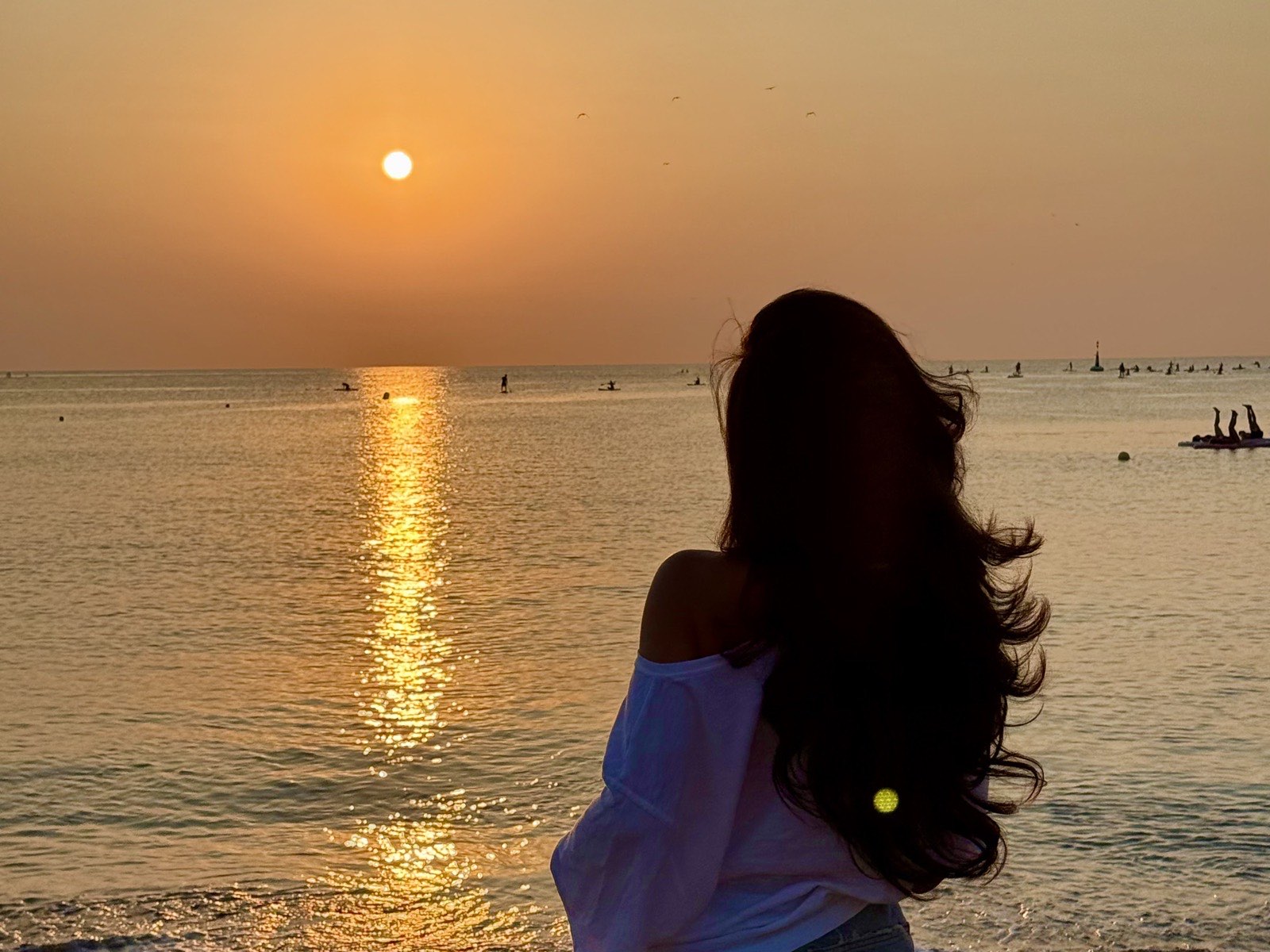 Sunrise photoshoot silhouette on Barceloneta beach in Barcelona at golden hour